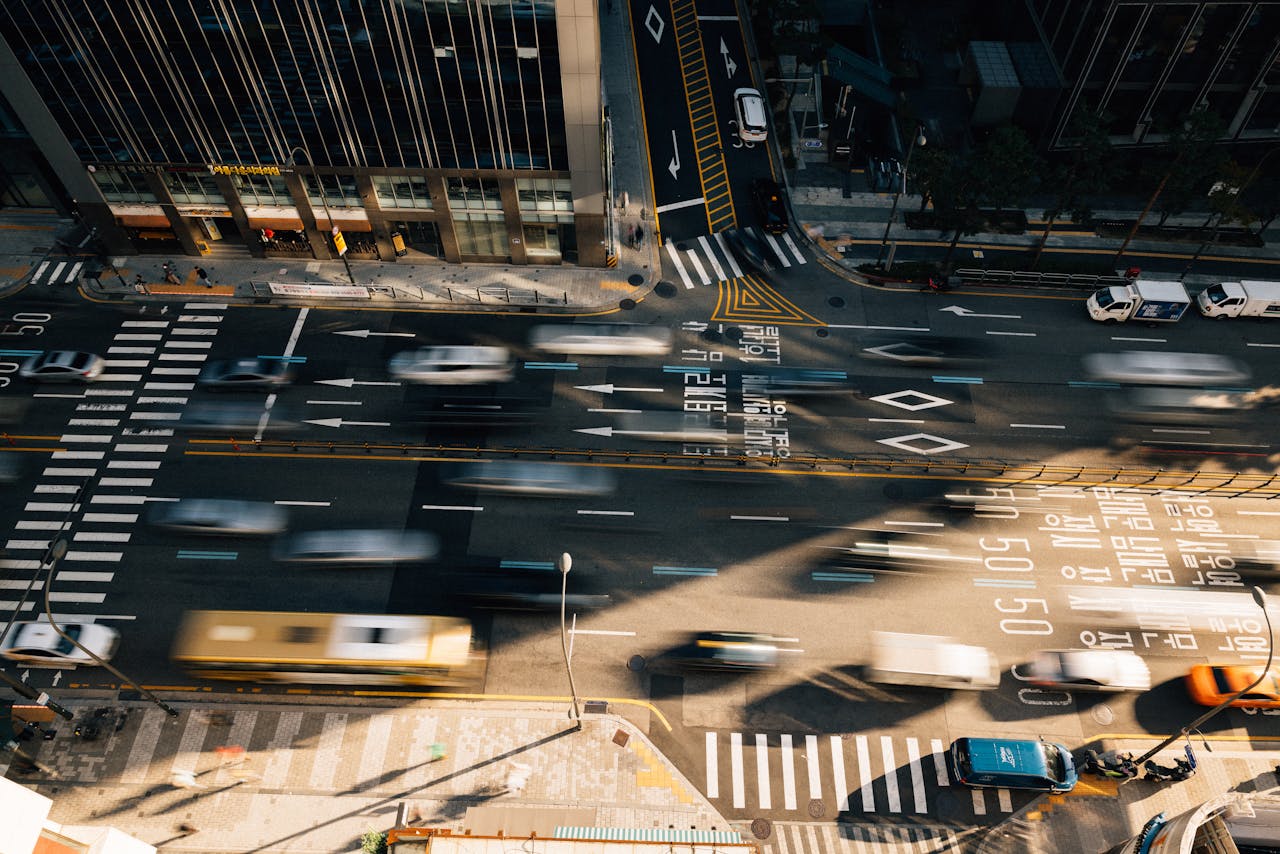 Aerial view of bustling traffic in Seoul with motion blur capturing urban energy.