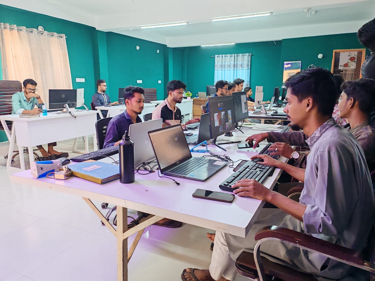 modern-office-team-working-collaboratively-on-computers-36706825